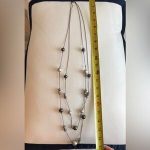 Double strand, gray, and silver bauble necklace.